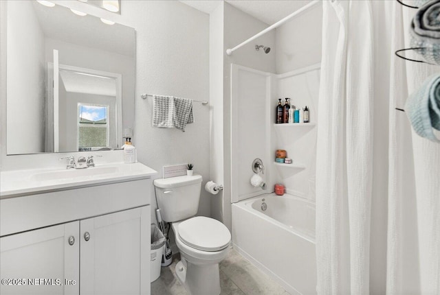 full bathroom featuring vanity, shower / bath combo, and toilet