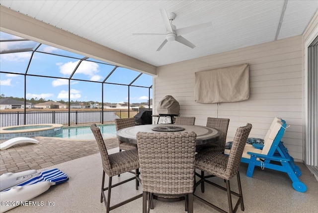 view of patio / terrace featuring ceiling fan, a lanai, and a pool with hot tub