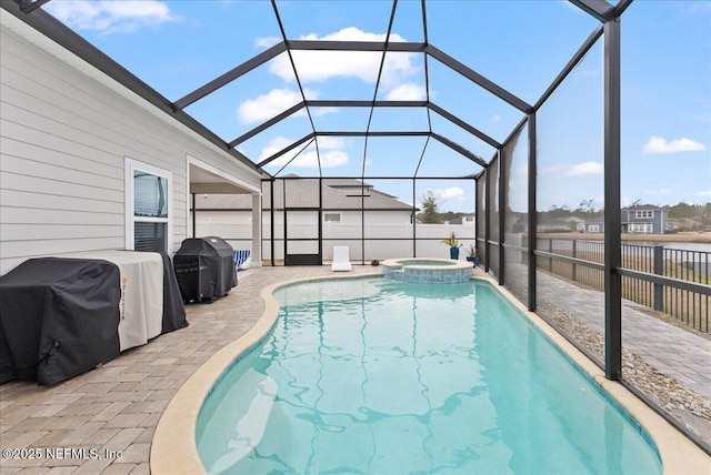 view of swimming pool featuring a grill, an in ground hot tub, a patio, and glass enclosure