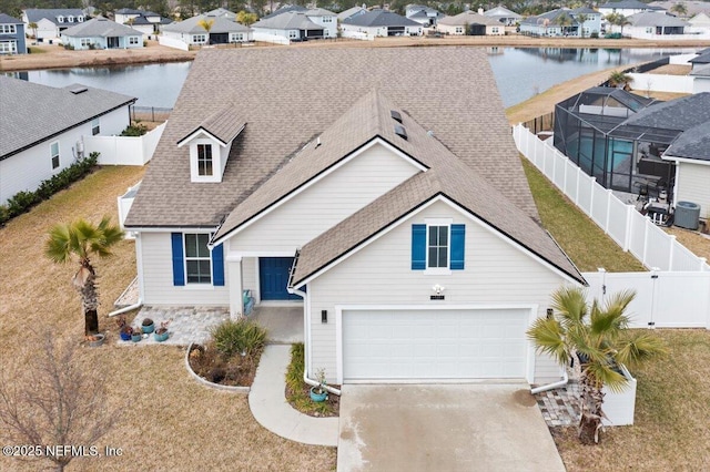 view of front of property featuring a water view, central AC, and a front lawn