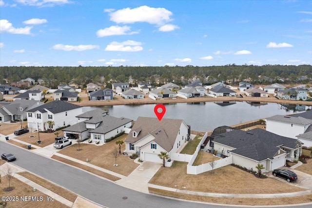 birds eye view of property featuring a water view