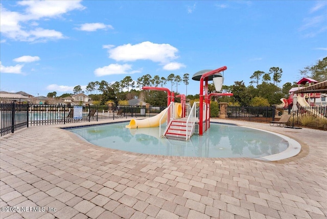 view of pool featuring a playground