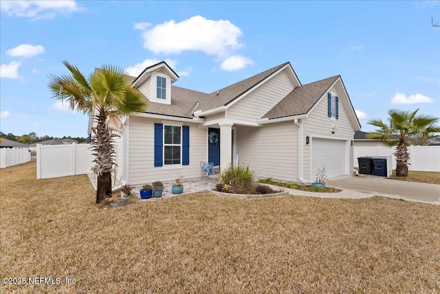 view of front of property featuring a garage and a front yard