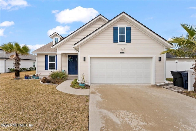 view of front facade with a garage and a front lawn