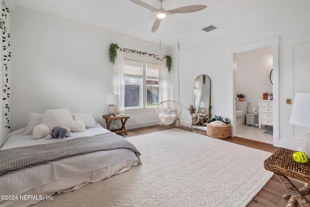 bedroom featuring ceiling fan, ornamental molding, and hardwood / wood-style floors