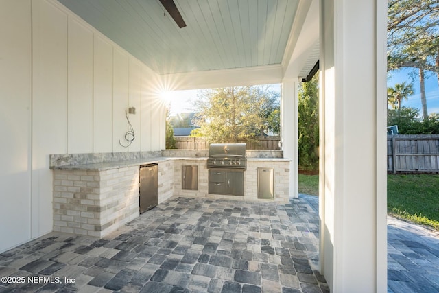 view of patio / terrace with a grill and an outdoor kitchen