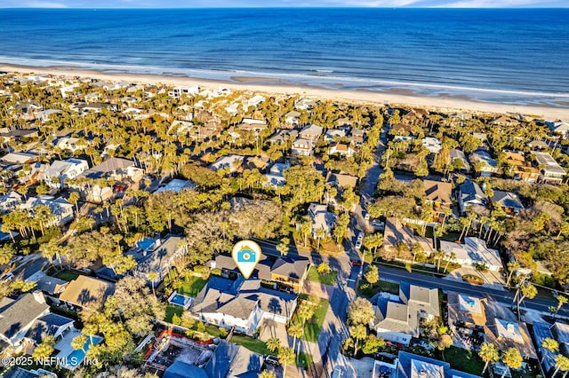 drone / aerial view featuring a view of the beach and a water view