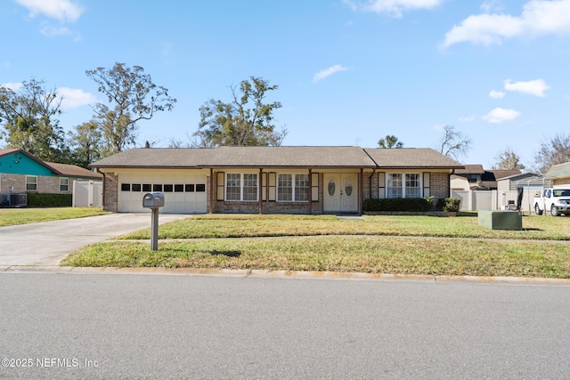 ranch-style home with a front lawn, a garage, and central AC