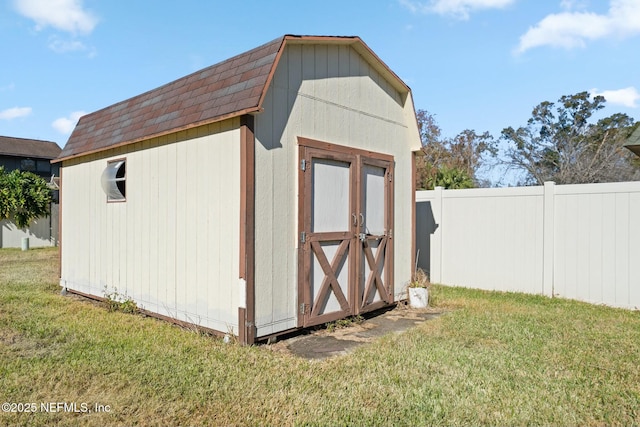 view of outdoor structure featuring a yard