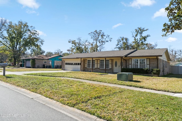 single story home with a front lawn and a garage