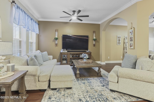 living room featuring wood-type flooring, ornamental molding, and ceiling fan