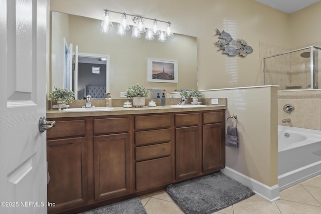 bathroom with tile patterned flooring, vanity, and independent shower and bath