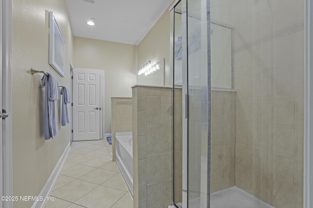 bathroom with tile patterned floors and independent shower and bath