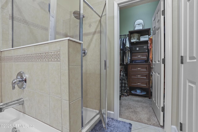 bathroom featuring a shower with door and tile patterned flooring