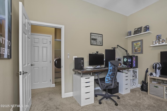 carpeted home office with washer / dryer