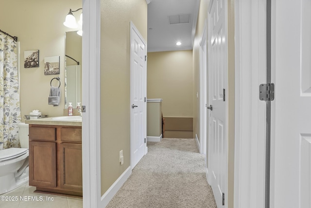 hallway with light colored carpet