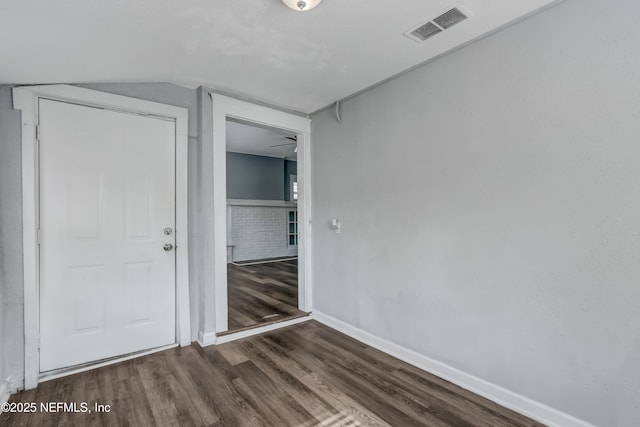 unfurnished bedroom with dark wood-type flooring