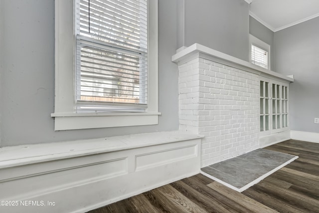 interior details featuring ornamental molding and hardwood / wood-style flooring