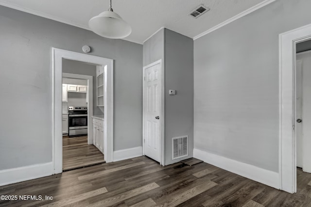 unfurnished bedroom with a textured ceiling, dark hardwood / wood-style flooring, and crown molding