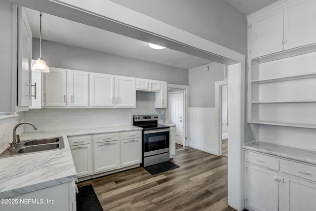 kitchen featuring dark hardwood / wood-style floors, pendant lighting, stainless steel electric range, sink, and white cabinetry