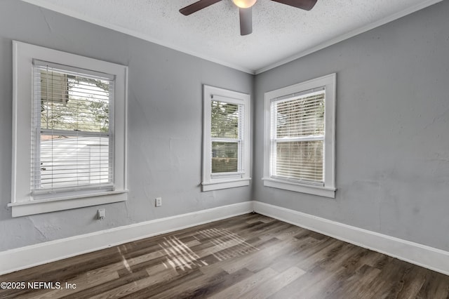 empty room with ceiling fan, wood-type flooring, crown molding, and a textured ceiling