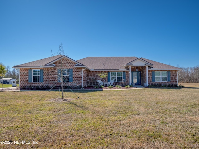 ranch-style home with a front yard