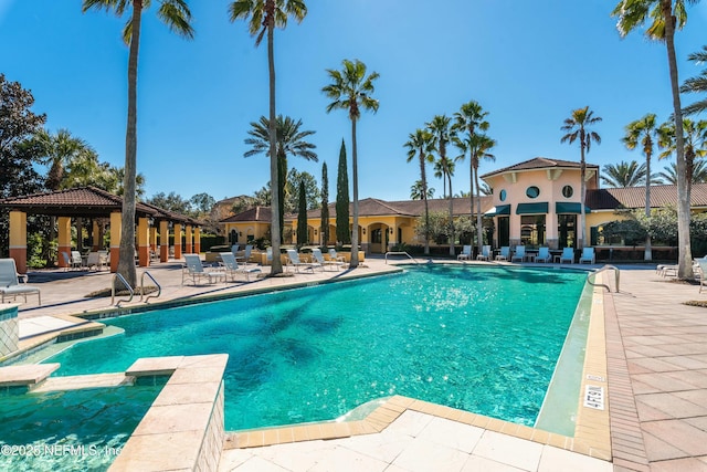 view of swimming pool featuring a gazebo and a patio area