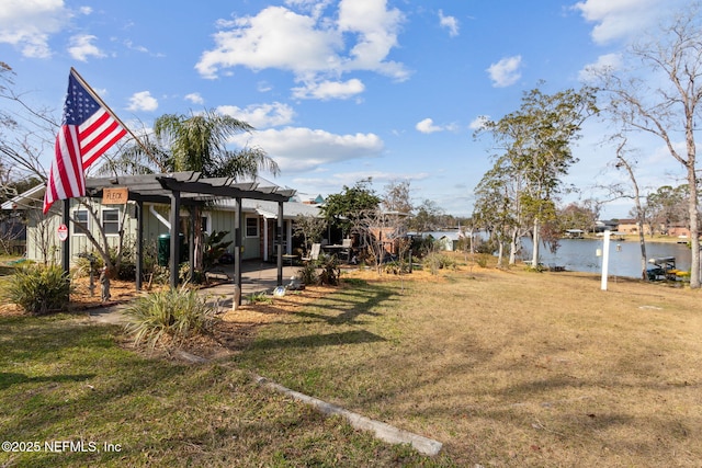 view of yard featuring a patio and a water view