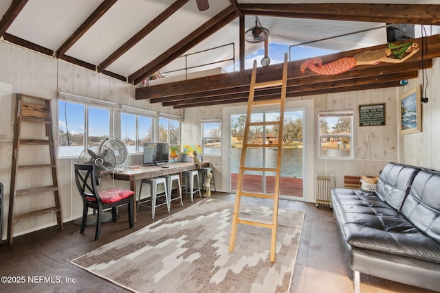 sunroom featuring radiator and vaulted ceiling with beams