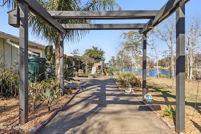 view of home's community featuring a water view and a patio