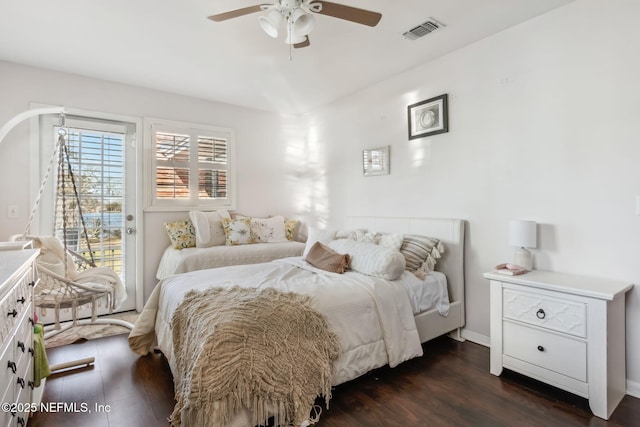 bedroom featuring visible vents, access to exterior, dark wood-style floors, baseboards, and ceiling fan