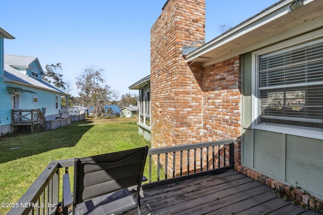 wooden deck with a yard