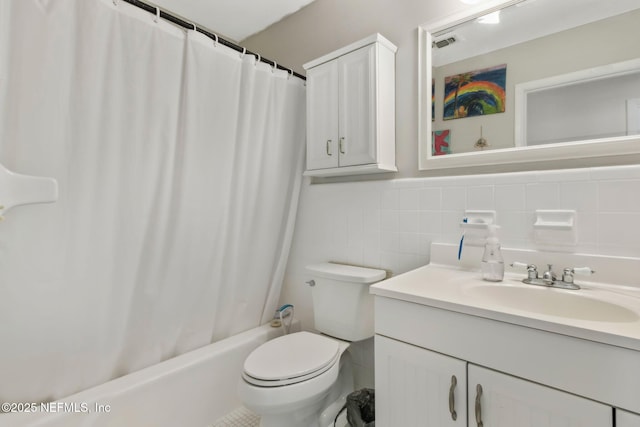 full bath with vanity, visible vents, tile walls, toilet, and shower / tub combo with curtain