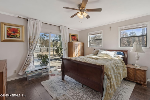 bedroom with dark wood-type flooring, multiple windows, access to exterior, and ornamental molding