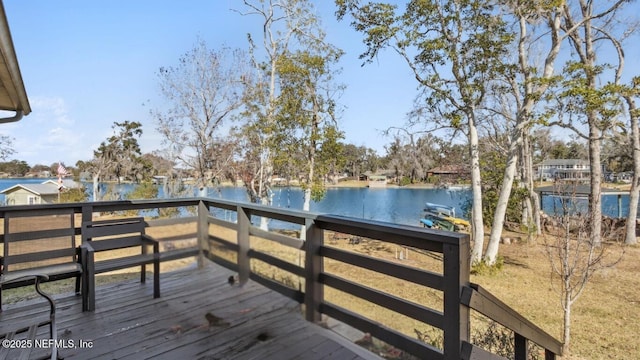 wooden deck with a water view