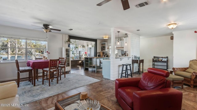 living room featuring visible vents, ceiling fan, and tile patterned flooring