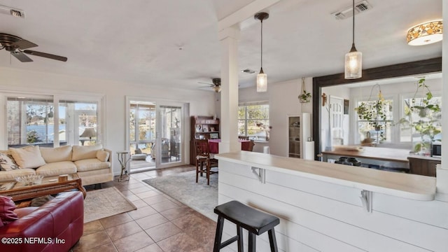 kitchen featuring open floor plan, visible vents, and ceiling fan