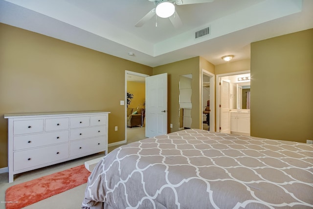 bedroom featuring ensuite bathroom and ceiling fan