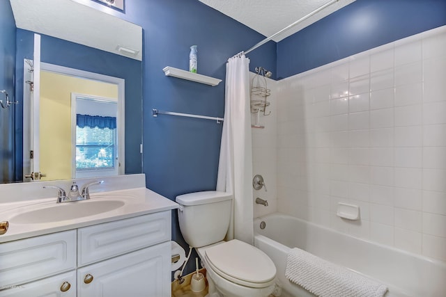 full bathroom featuring a textured ceiling, toilet, vanity, and shower / bath combo with shower curtain