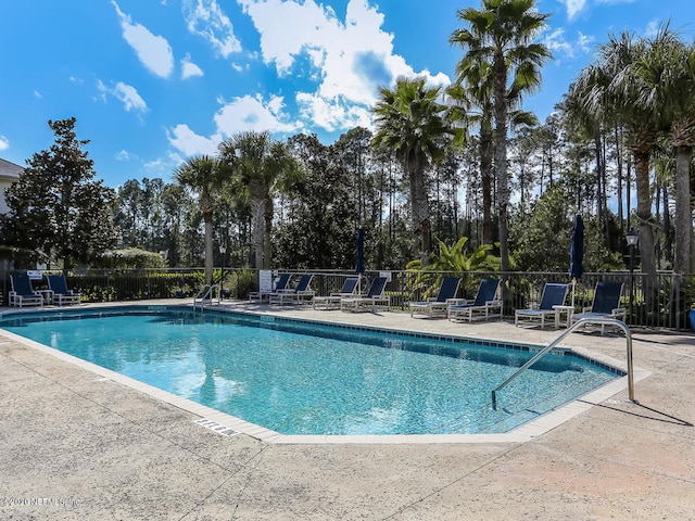 view of pool featuring a patio