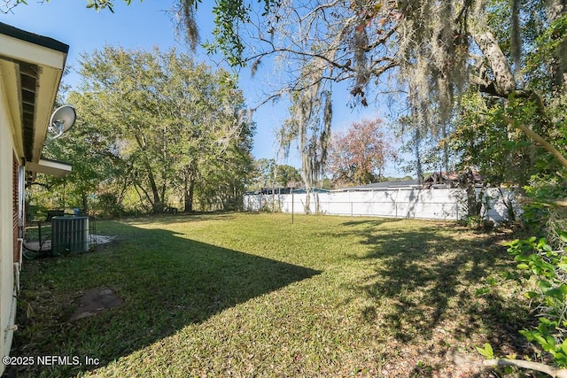 view of yard with central AC