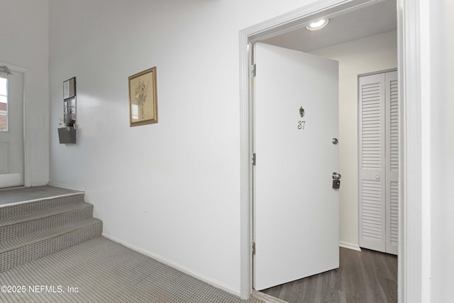 hall with dark wood-type flooring