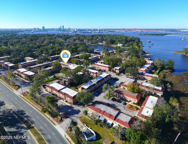 birds eye view of property with a water view