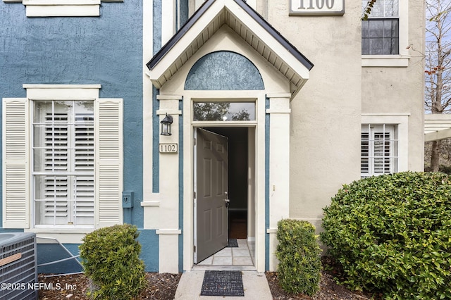 doorway to property with central AC