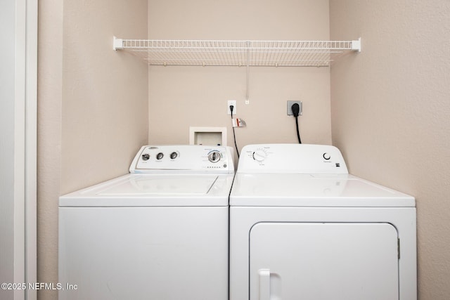 clothes washing area featuring laundry area and independent washer and dryer