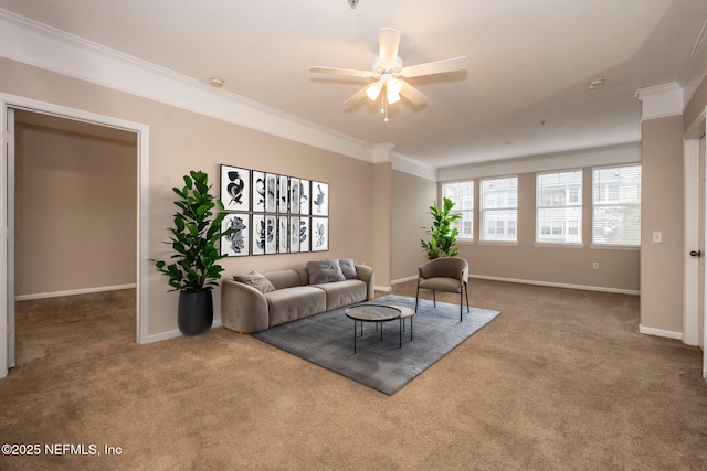 carpeted living room featuring ceiling fan, baseboards, and ornamental molding