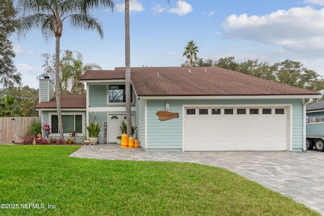 exterior space with a garage and a yard