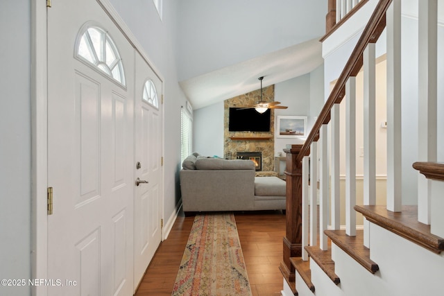 foyer with a fireplace, dark hardwood / wood-style flooring, and plenty of natural light