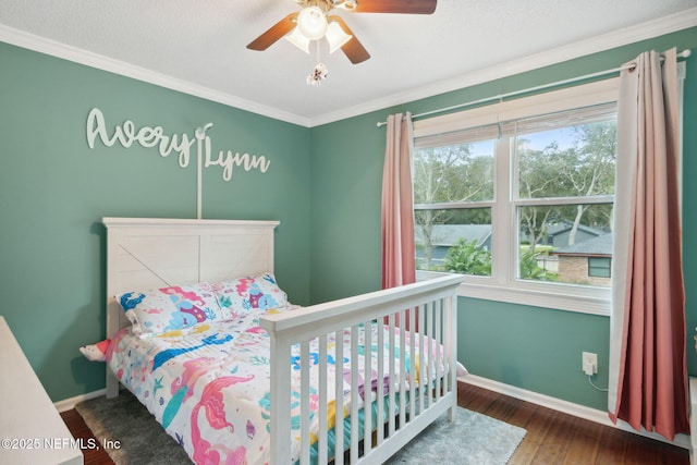 bedroom with ceiling fan, crown molding, and dark hardwood / wood-style floors