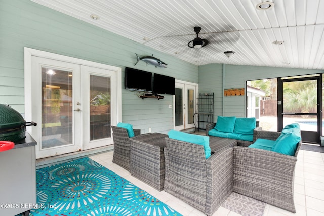 view of patio / terrace with ceiling fan, an outdoor living space, and french doors